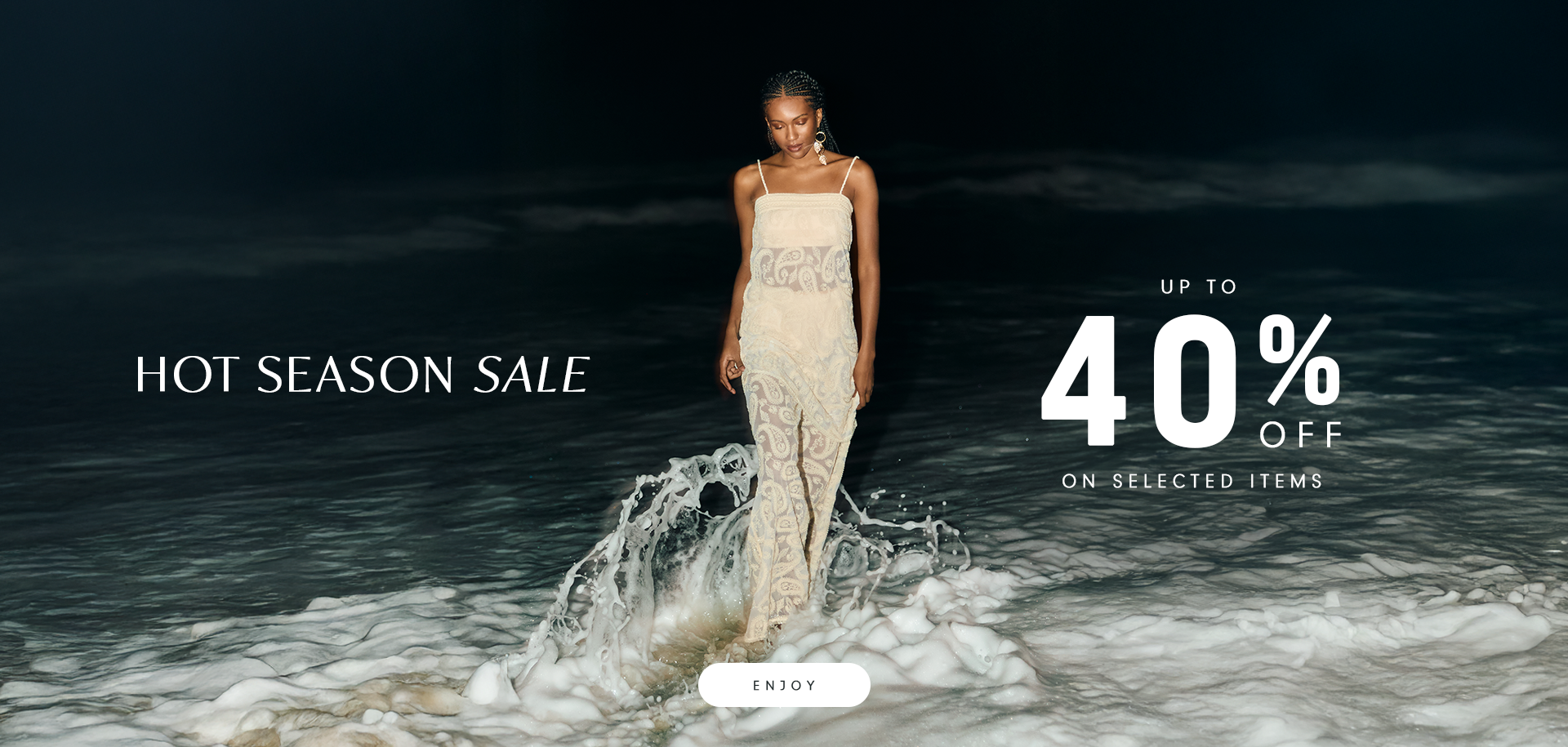 Woman walking by the shore at night, wearing a light, elegant dress. Text on the image reads: "Hot Season Sale – Up to 40% off on selected items".