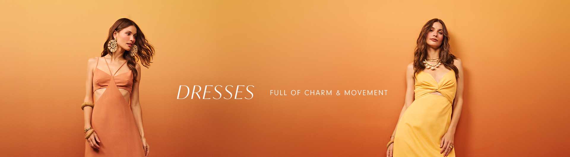 Two women wearing elegant summer dresses in warm tones, one in terracotta and the other in yellow, posing against a gradient orange background with the text 'Dresses – Full of charm & movement' in the center.