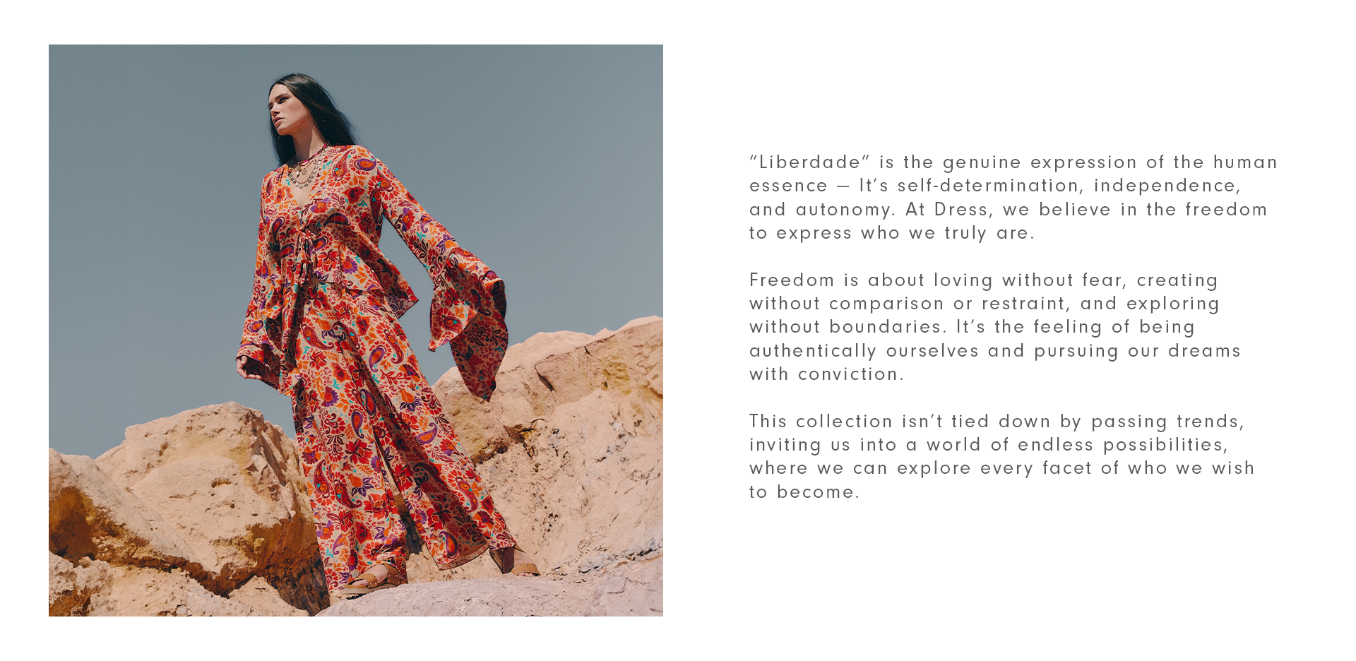 Model wearing a floral-printed matching set of long-sleeve blouse and pants. Model in stone and sand dunes.