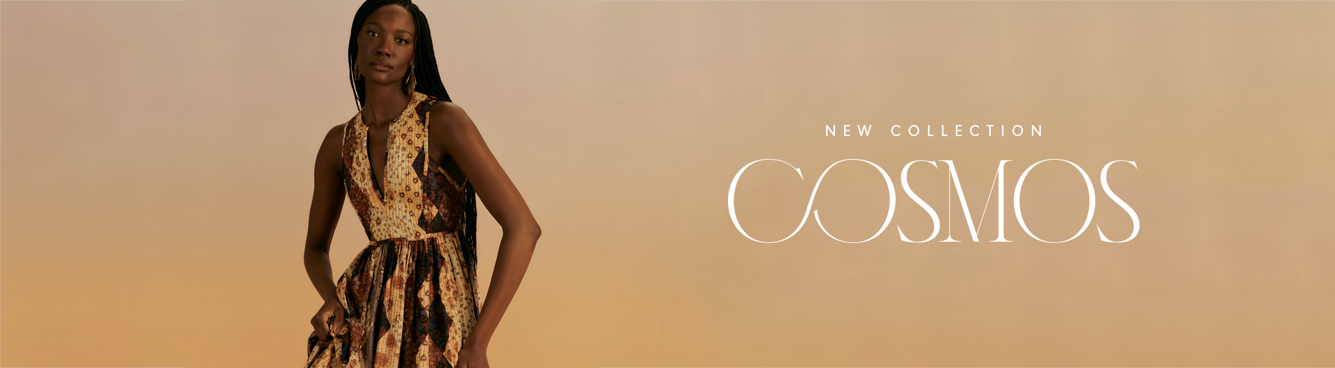 Banner with a gradient background in warm tones, transitioning from yellow to beige, featuring a dark-skinned woman with braided hair wearing a geometric-patterned dress in earthy tones. On the right side, the text 'NEW COLLECTION' appears above the word 'COSMOS' in a stylized and elegant font.